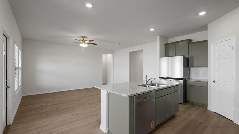439 Epiphany Lane Lavon, TX 75166 - Photo 2 of 31 Open-concept living space featuring wood-finish flooring, recessed lighting, and a ceiling fan
