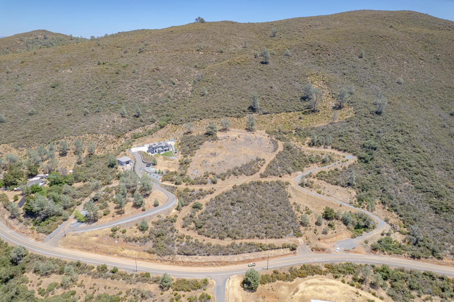 417 Salmon Falls Road El Dorado Hills, CA 95762 - Photo 24 of 47 a view of a dry field with a mountain in the background