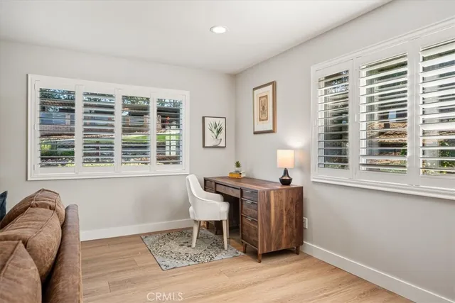 a kitchen with stainless steel appliances kitchen island granite countertop a refrigerator and a sink