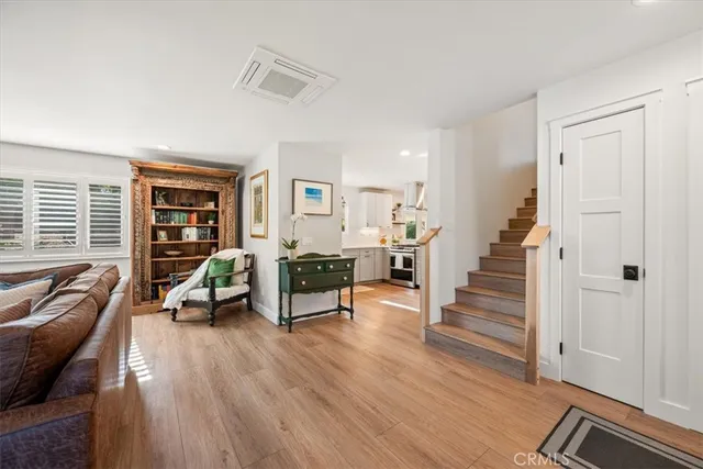 a kitchen with stainless steel appliances kitchen island granite countertop a sink and cabinets
