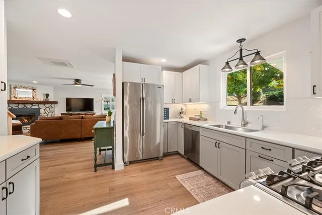 a spacious bedroom with a bed and a dresser