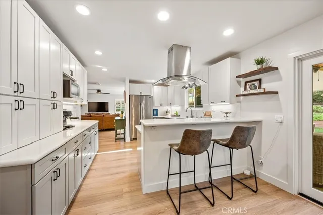 a bathroom with a sink a mirror and a shower