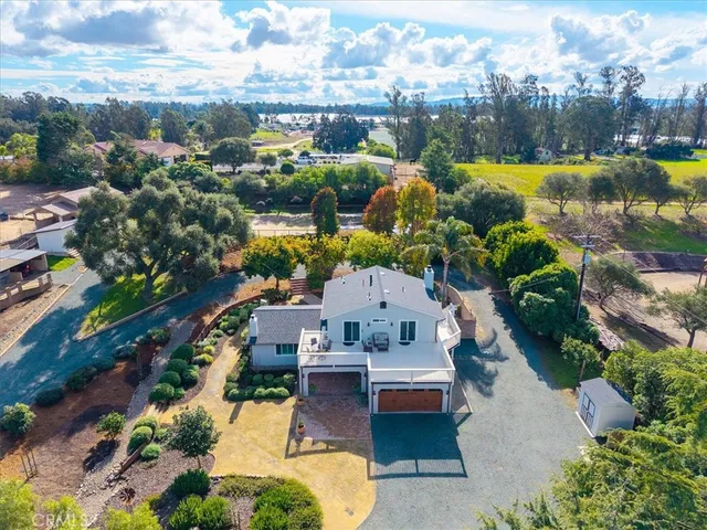 an aerial view of a house with swimming pool
