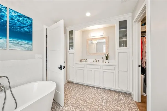 a bedroom with furniture and wooden floor