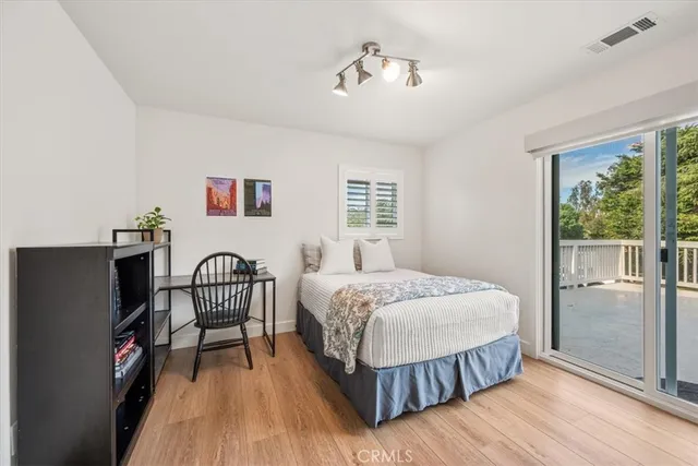 a view of kitchen island with stainless steel appliances granite countertop sink and cabinets