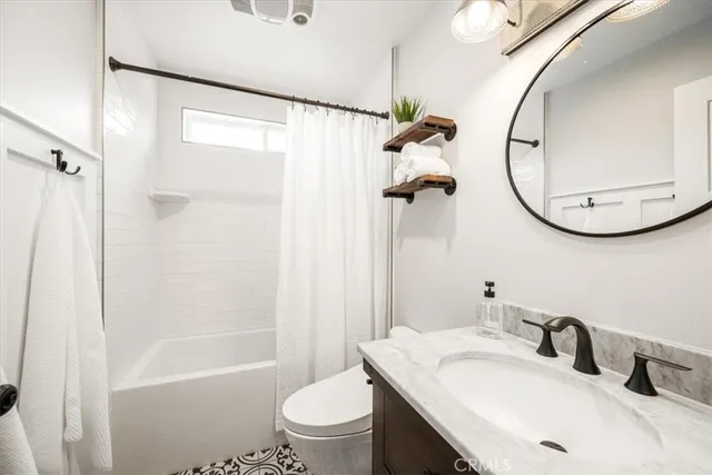 a kitchen with stainless steel appliances granite countertop a refrigerator and a stove