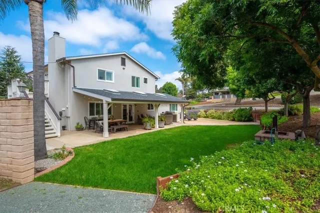 a view of a patio in a backyard