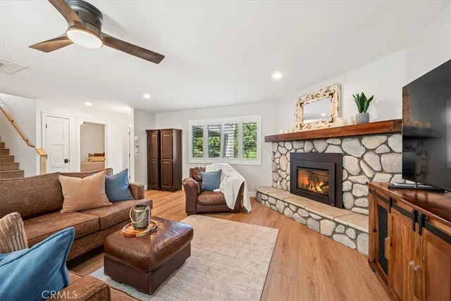 a kitchen with stainless steel appliances granite countertop a stove a sink dishwasher and a refrigerator