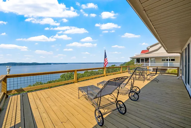 a view of swimming pool with seating area and furniture