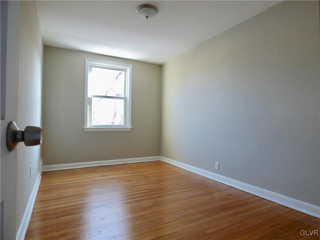 1925 South Delaware Street Allentown, PA 18103 - Photo 11 of 16 wooden floor in an empty room with a window