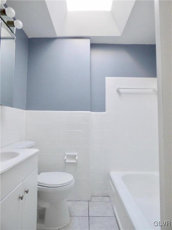 1925 South Delaware Street Allentown, PA 18103 - Photo 12 of 16 a bathroom with a sink a toilet and bathtub