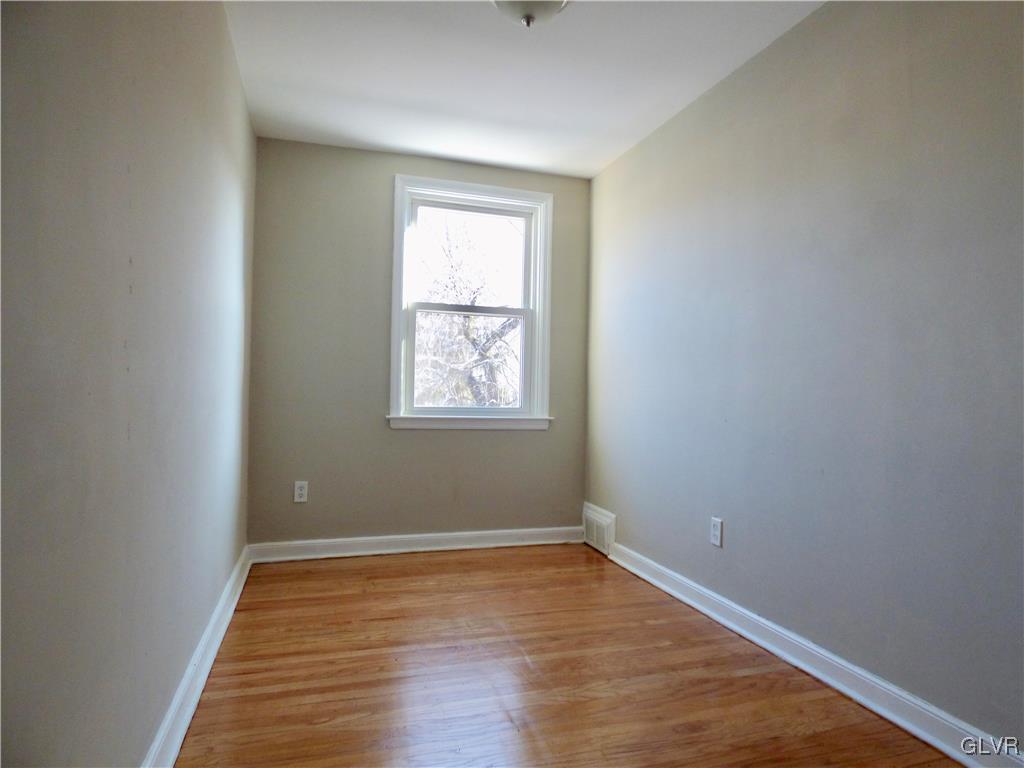 1925 South Delaware Street Allentown, PA 18103 - Photo 10 of 16 an empty room with wooden floor and windows