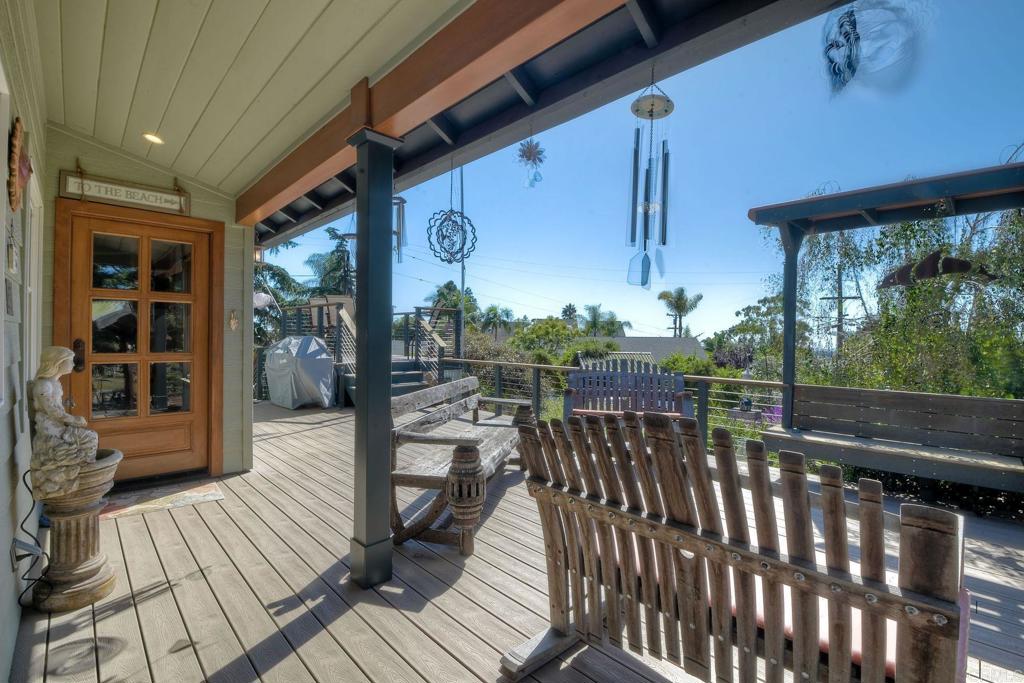 a view of a balcony with wooden floor