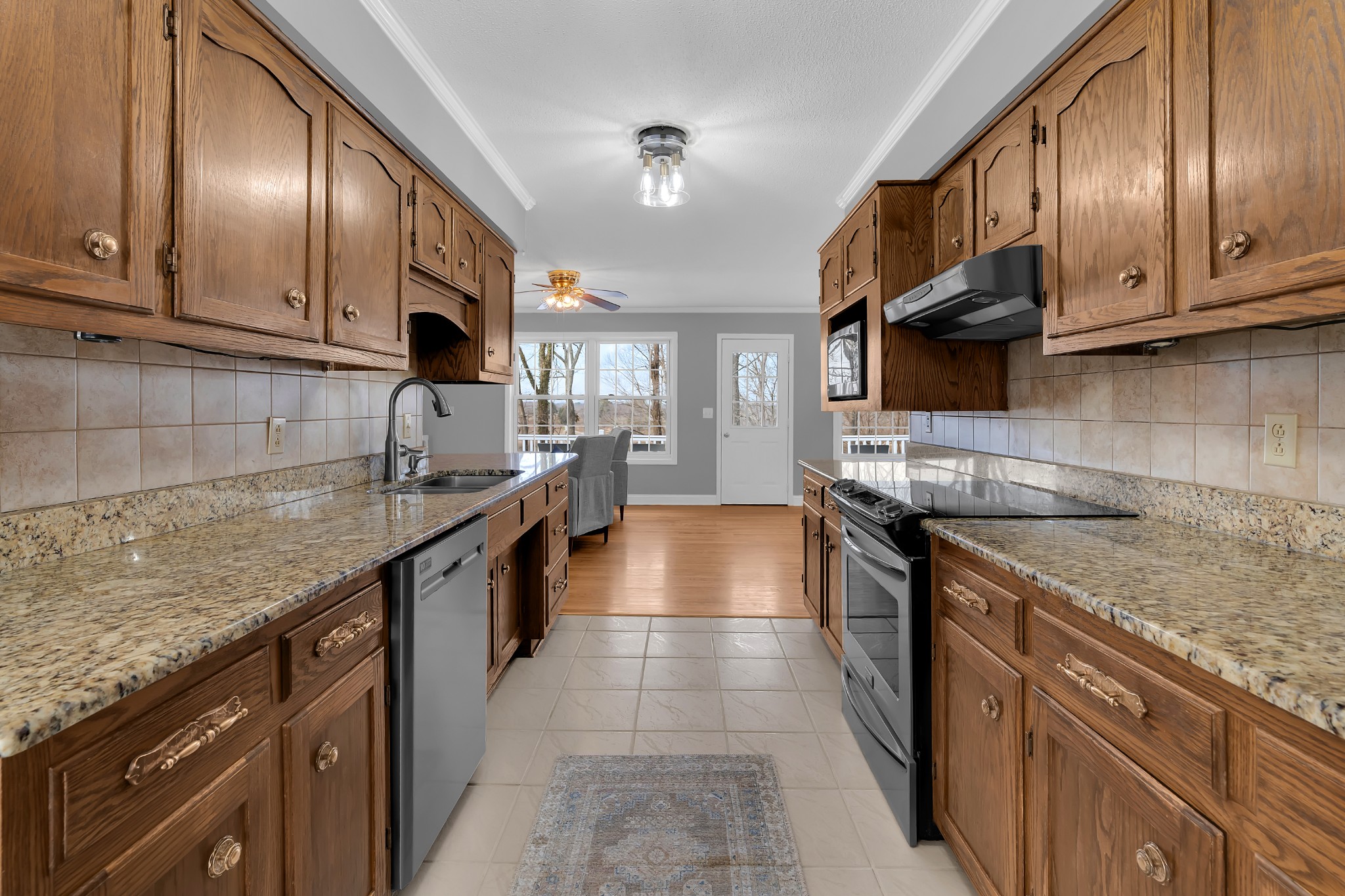 182 Loop Drive Winchester, TN 37398 - Photo 13 of 60 a kitchen with stainless steel appliances granite countertop a sink stove and cabinets