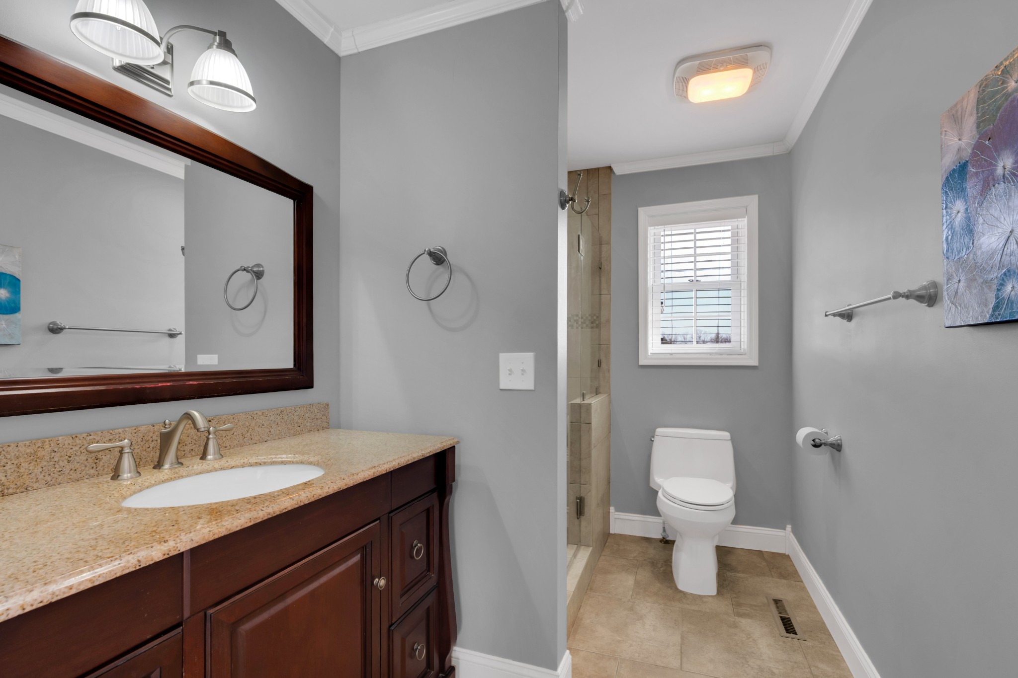 182 Loop Drive Winchester, TN 37398 - Photo 16 of 60 a bathroom with a toilet a sink a mirror and a window