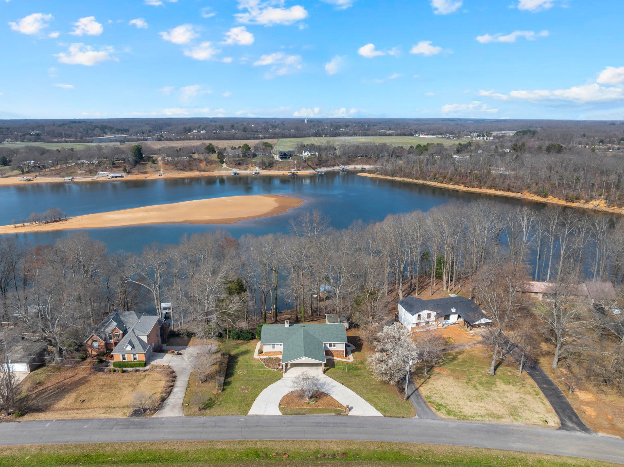 182 Loop Drive Winchester, TN 37398 - Photo 43 of 60 a view of a lake with a yard and mountain view
