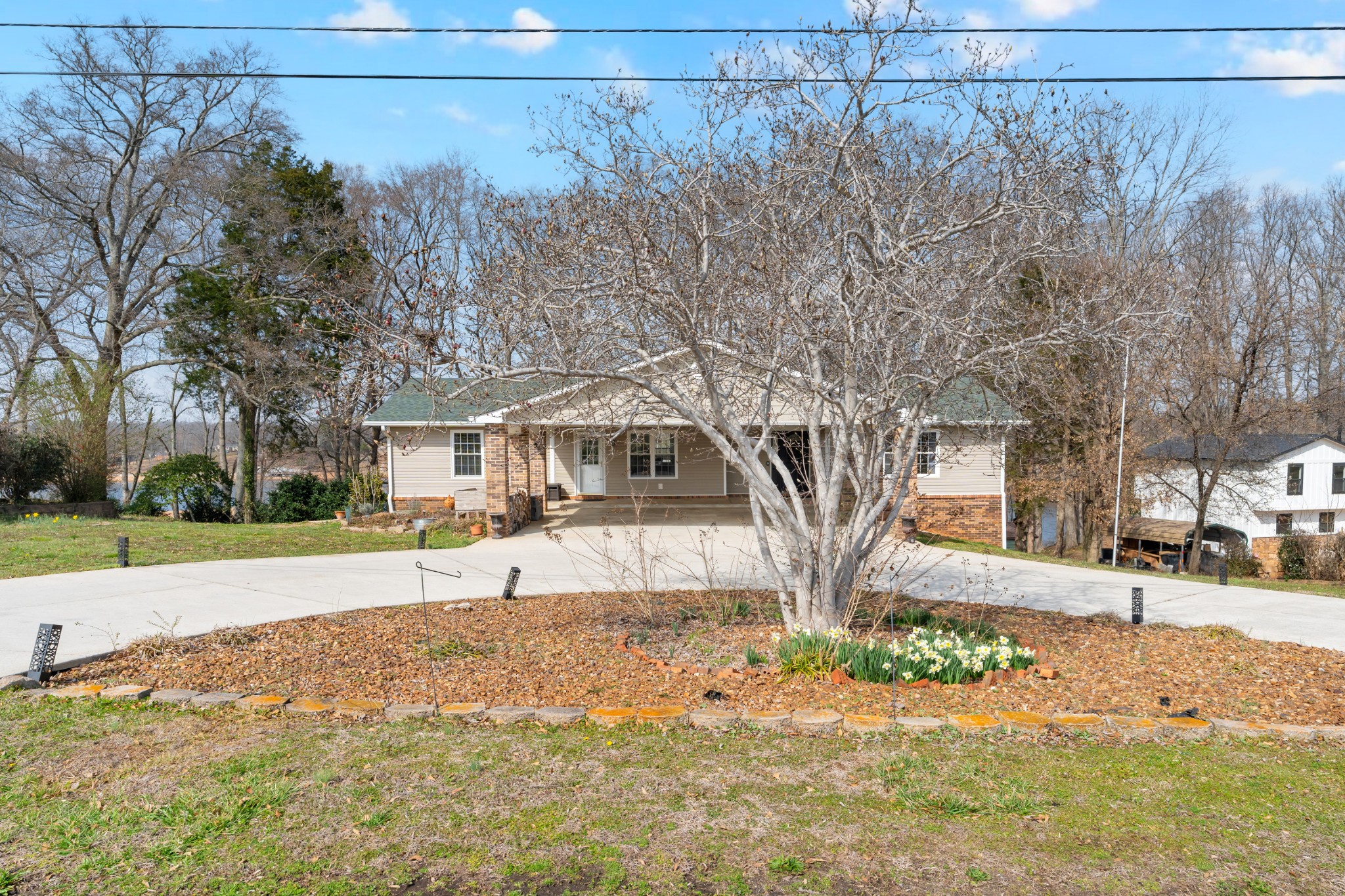 182 Loop Drive Winchester, TN 37398 - Photo 53 of 60 a front view of a house with a yard and garage