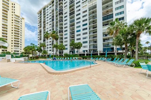 a view of a swimming pool with a patio