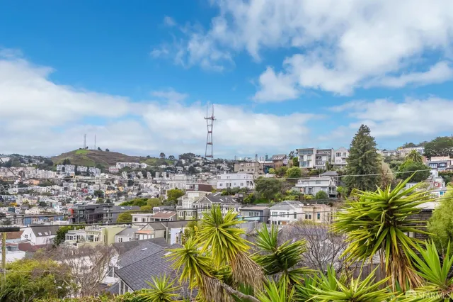 a view of hallway with wooden floor