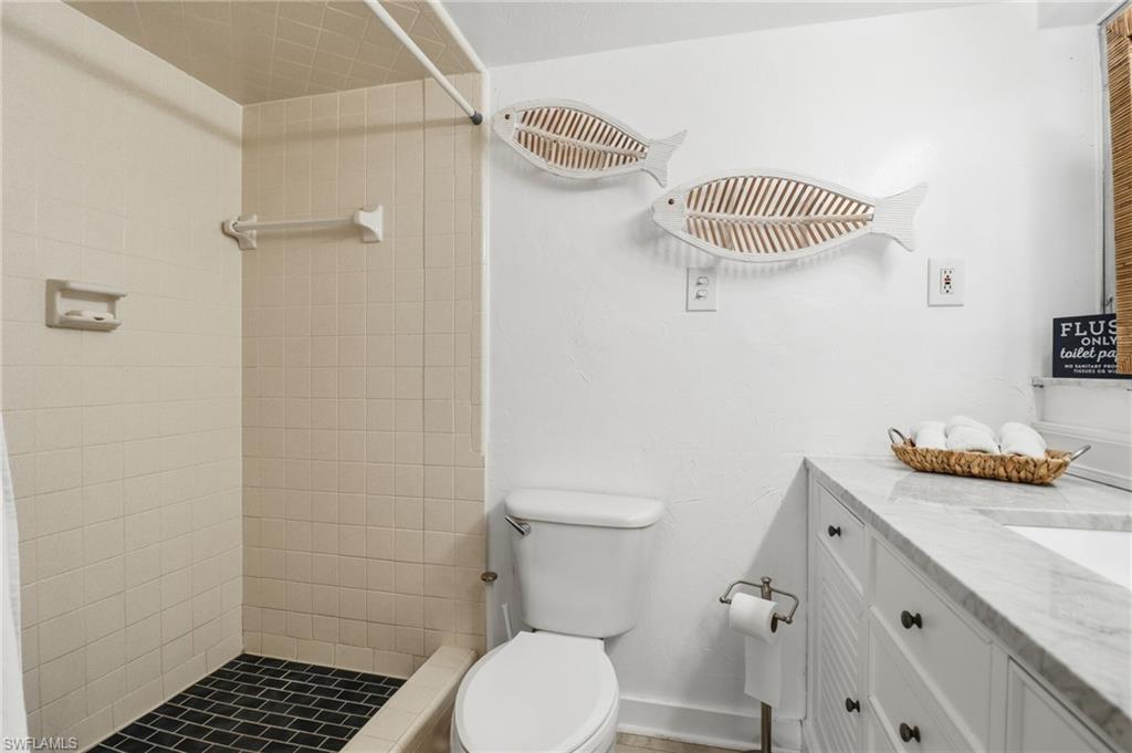 2211 Bayview Road Punta Gorda, FL 33950 - Photo 30 of 37 Full bath featuring vanity and a shower stall