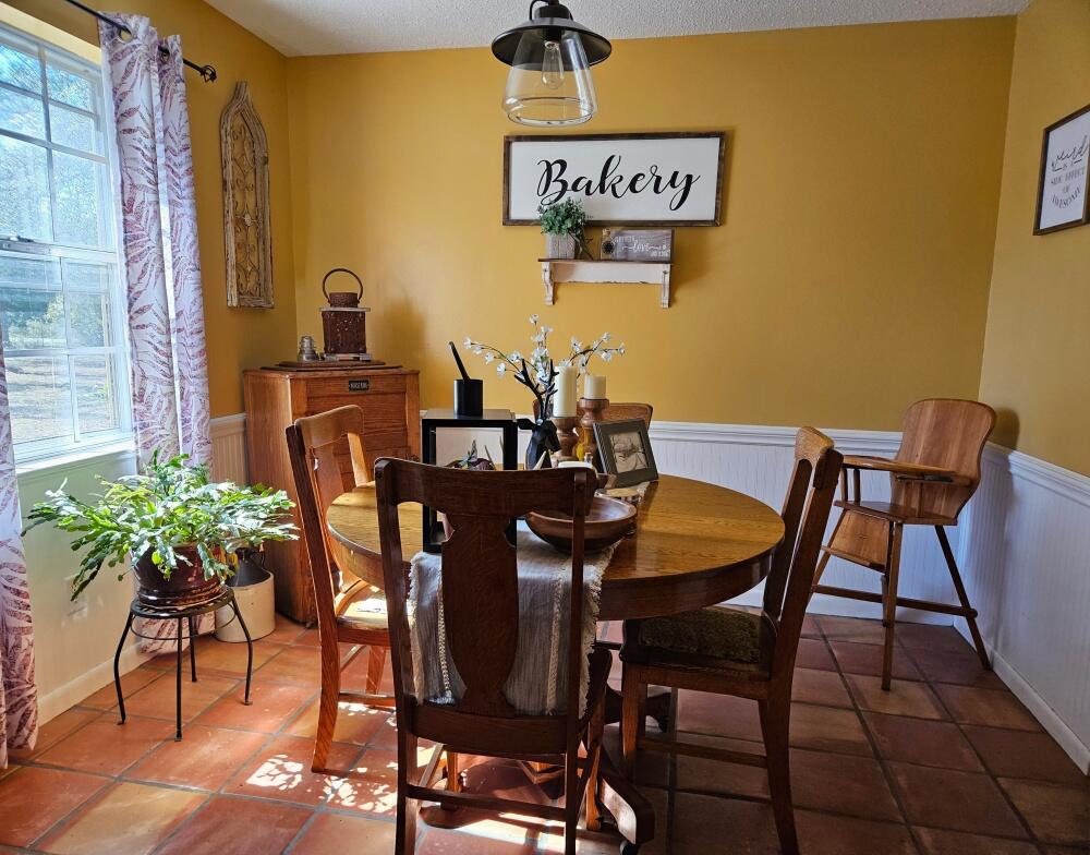 4017 Bear Creek Road Crestview, FL 32539 - Photo 3 of 30 a view of a dining room with furniture and wooden floor
