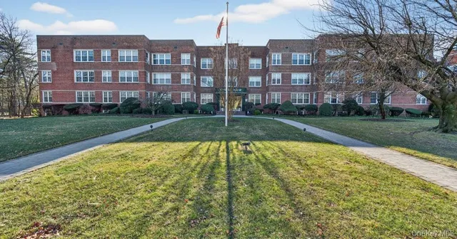 a view of a building with a yard