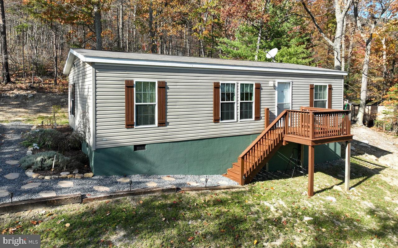 187 Holly Hl Road Luray, VA 22835 - Photo 1 of 60 a view of a house with backyard and sitting area