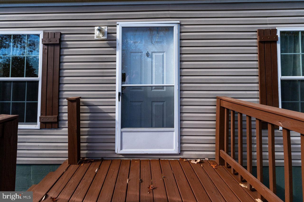 187 Holly Hl Road Luray, VA 22835 - Photo 25 of 60 a view of a balcony with a door and wooden floor