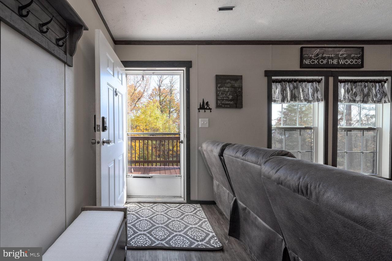 187 Holly Hl Road Luray, VA 22835 - Photo 26 of 60 a living room with furniture and a window