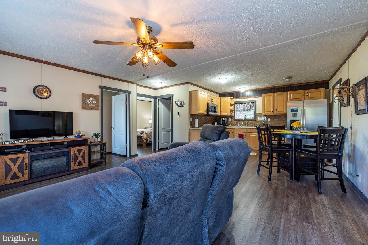 187 Holly Hl Road Luray, VA 22835 - Photo 27 of 60 a living room with furniture and a flat screen tv
