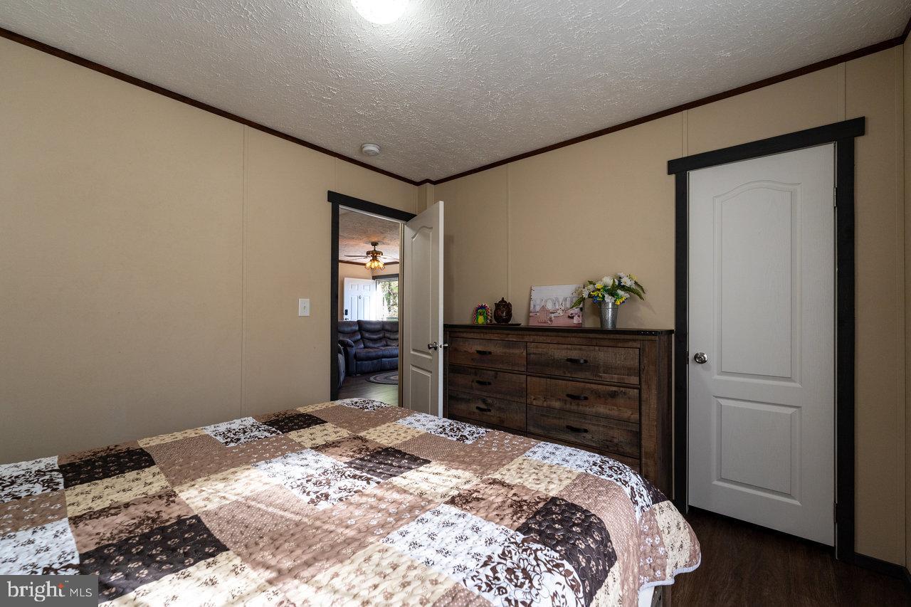 187 Holly Hl Road Luray, VA 22835 - Photo 40 of 60 a bedroom with a bed and a dresser