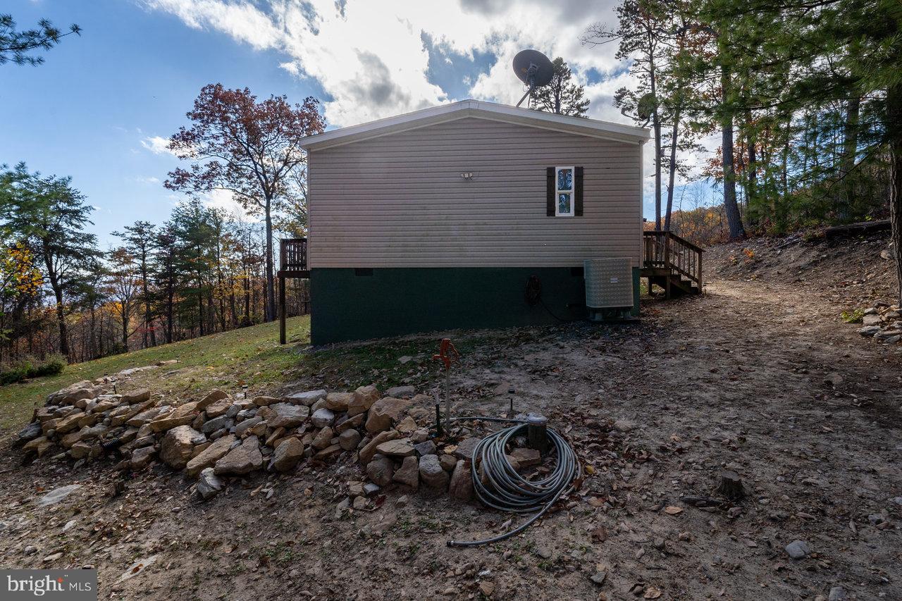 187 Holly Hl Road Luray, VA 22835 - Photo 51 of 60 a view of a house with a yard and a tree