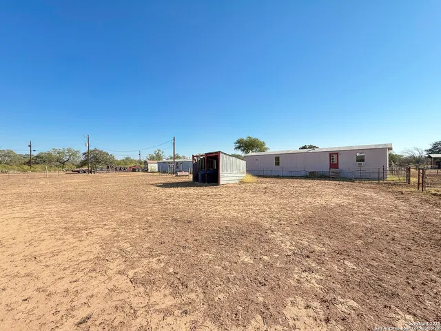 a view of a pool and an outdoor space