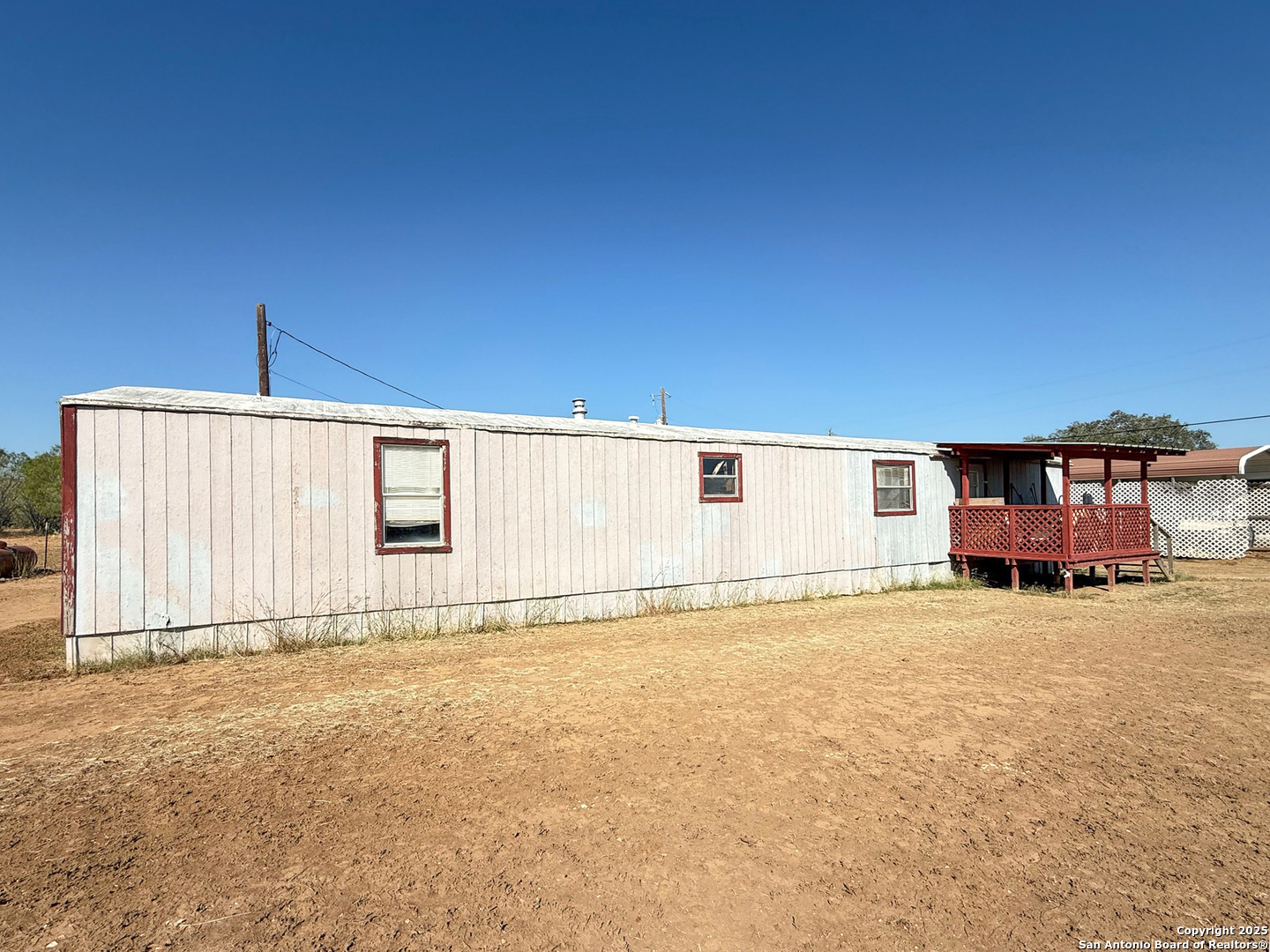179 Private Road 6624 Devine, TX 78016 - Photo 15 of 20 a view of a house with a backyard