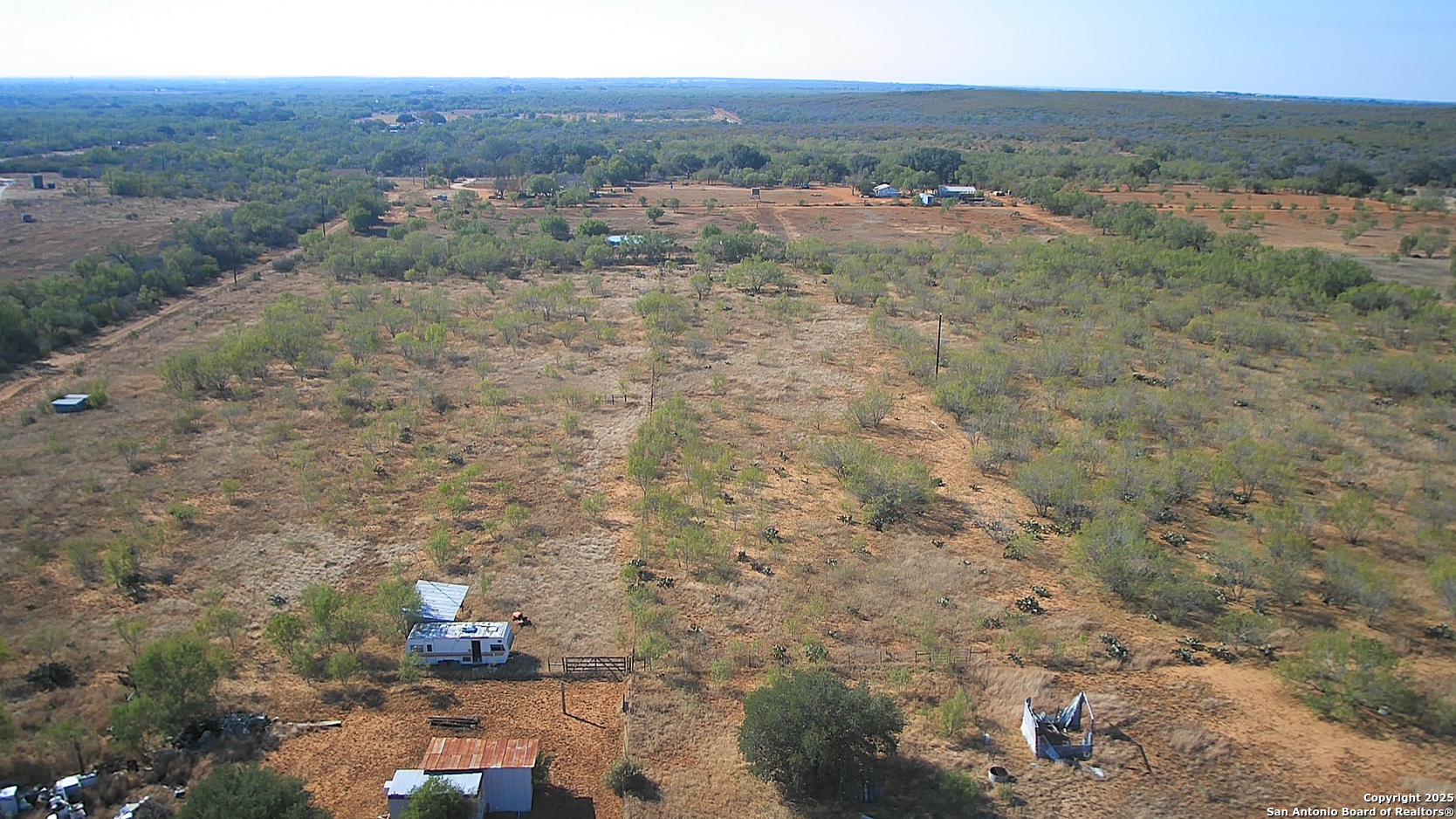 179 Private Road 6624 Devine, TX 78016 - Photo 18 of 20 a view of a city with lush green forest