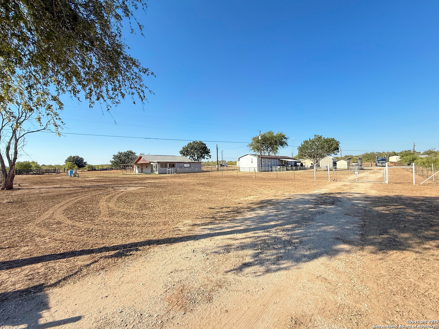 179 Private Road 6624 Devine, TX 78016 - Photo 2 of 20 a view of a yard with an ocean view