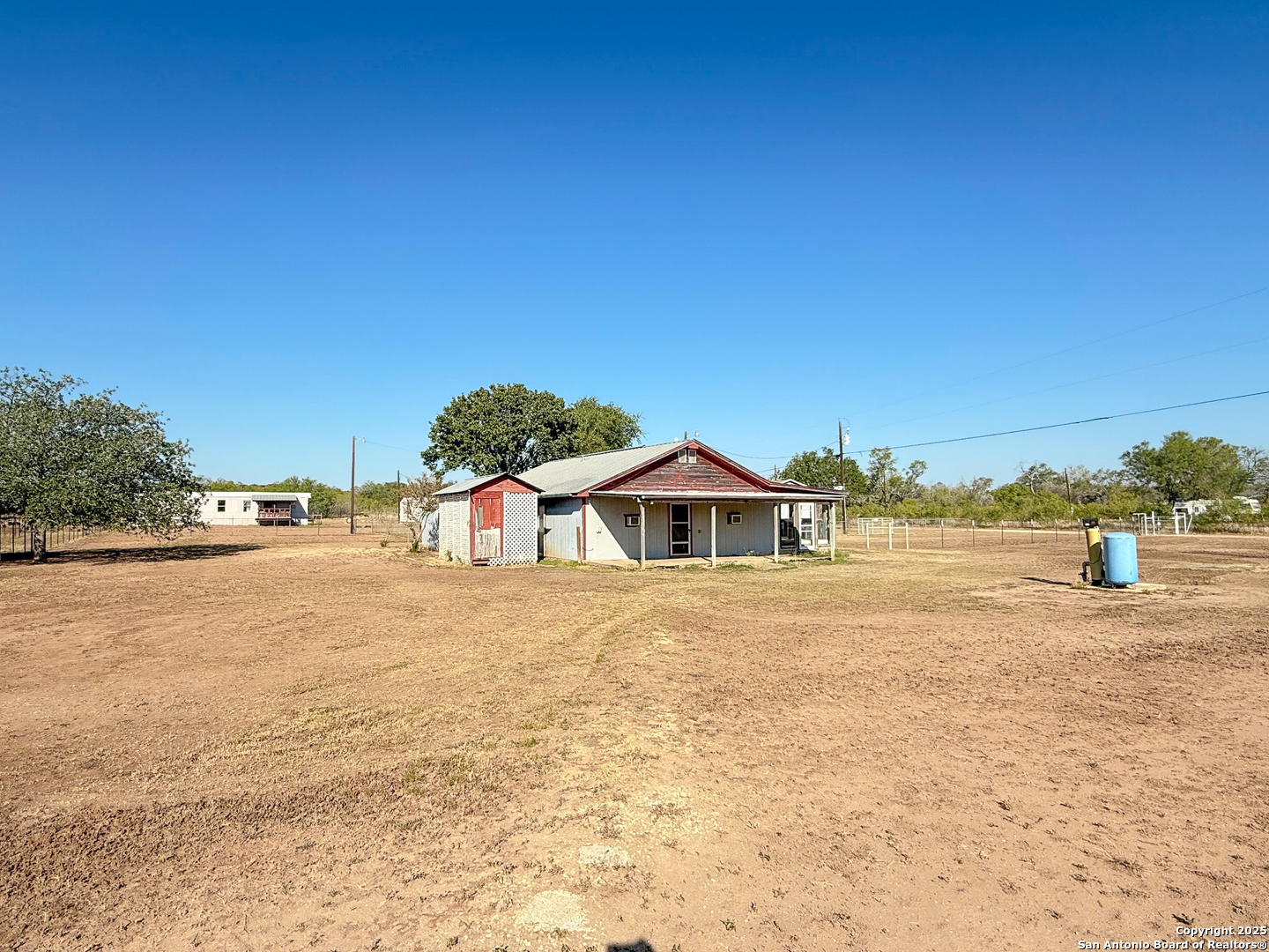 179 Private Road 6624 Devine, TX 78016 - Photo 5 of 20 a view of a house with a yard