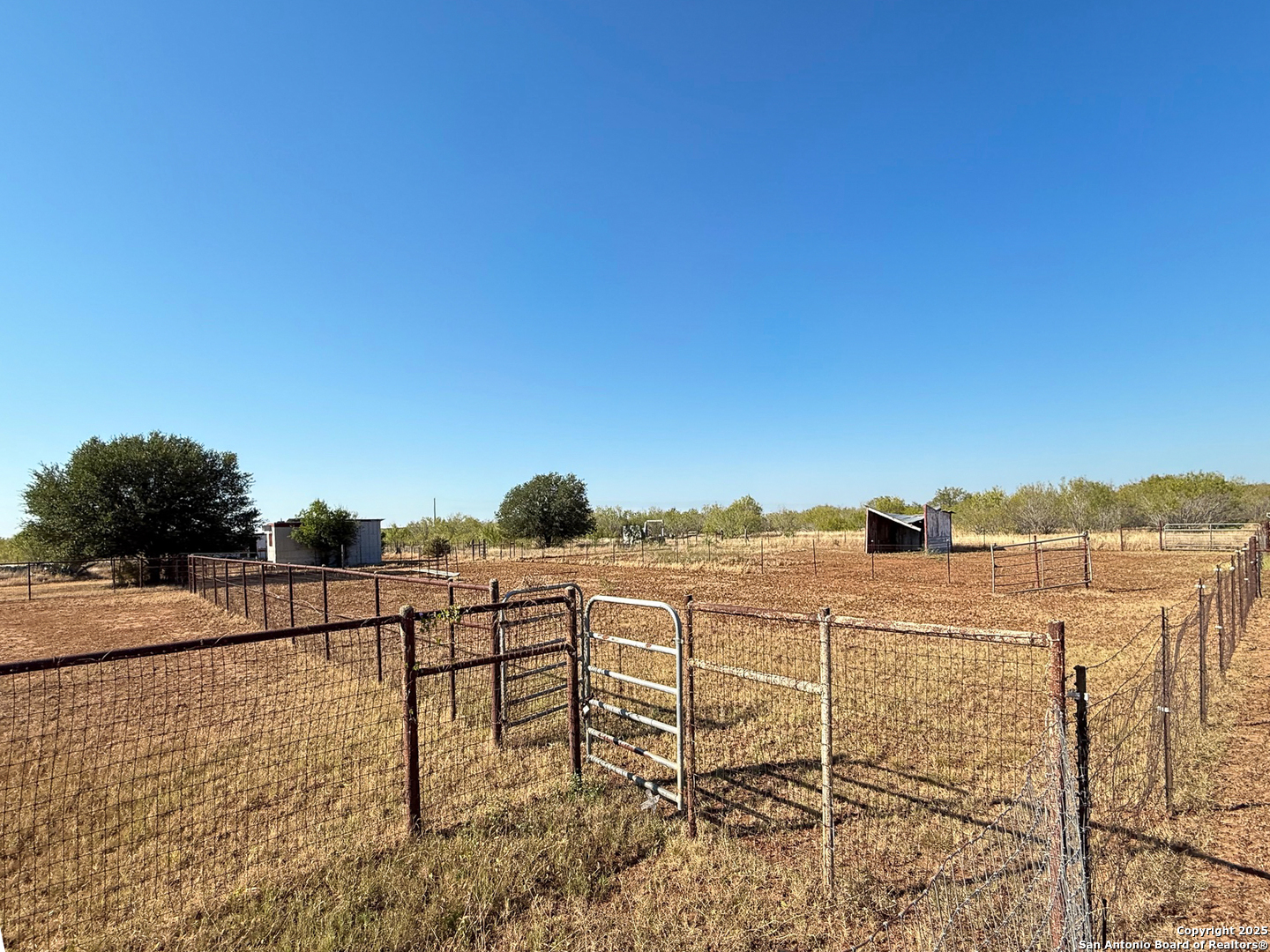 179 Private Road 6624 Devine, TX 78016 - Photo 6 of 20 a view of a terrace with chairs