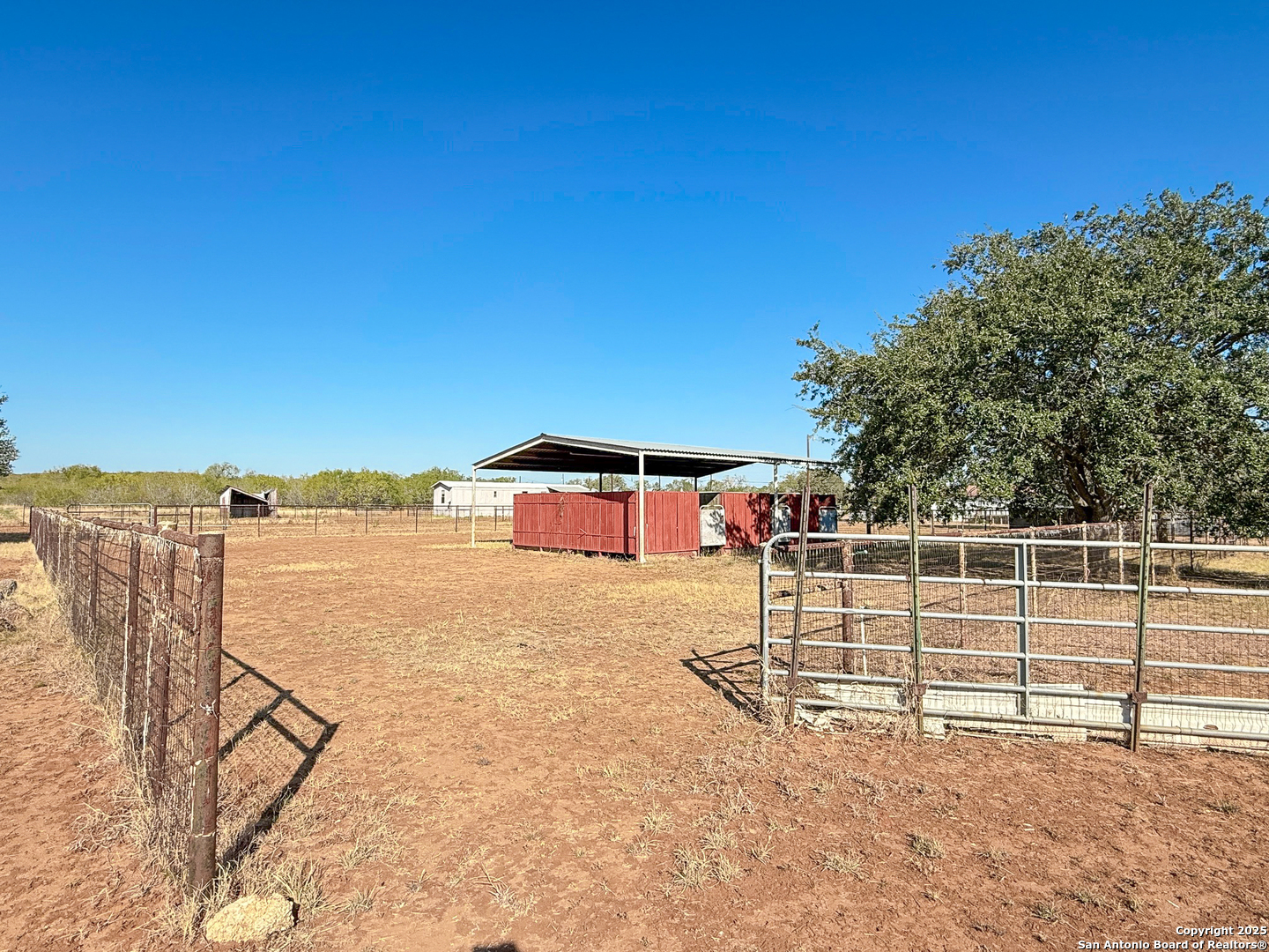 179 Private Road 6624 Devine, TX 78016 - Photo 7 of 20 swimming pool view with a lake view