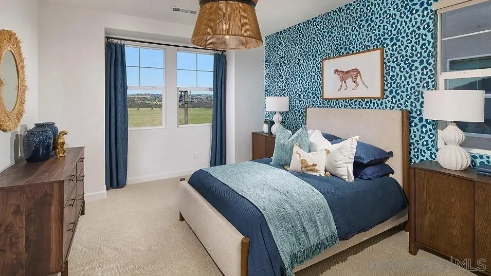 130 Mellano Way Oceanside, CA 92057 - Photo 13 of 26 a bedroom with a bed and a painting on the wall