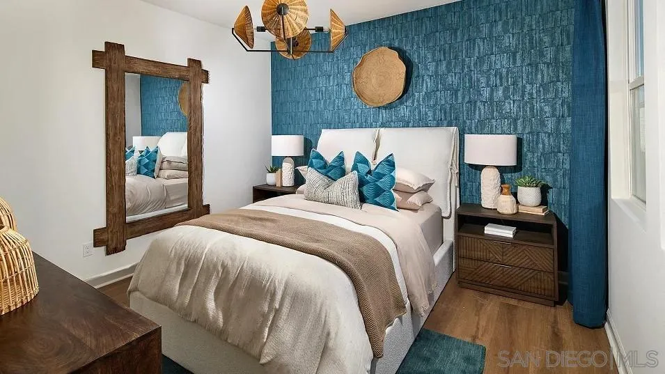 130 Mellano Way Oceanside, CA 92057 - Photo 15 of 26 a bedroom with a large bed and wooden floor