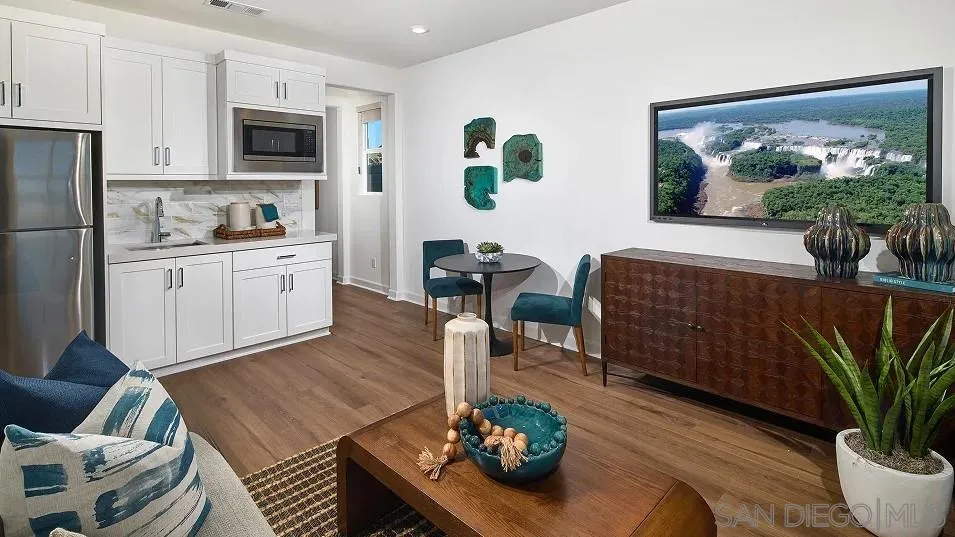 130 Mellano Way Oceanside, CA 92057 - Photo 5 of 26 a living room with furniture and a potted plant