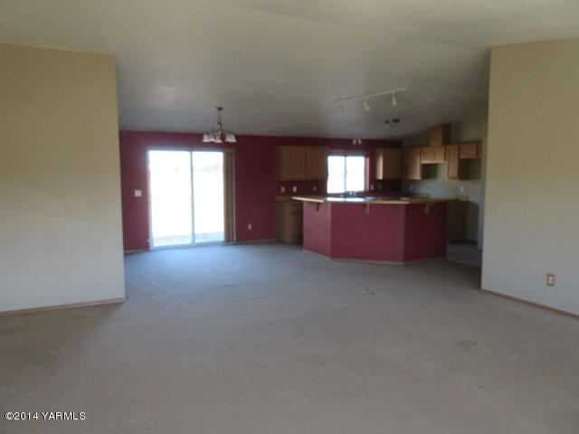 565 Sheep Company Road Selah, WA 98942 - Photo 21 of 30 a room with window and chandelier
