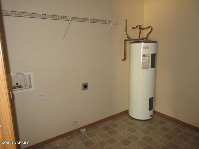 565 Sheep Company Road Selah, WA 98942 - Photo 26 of 30 a view of a storage & utility room with racks on the wall