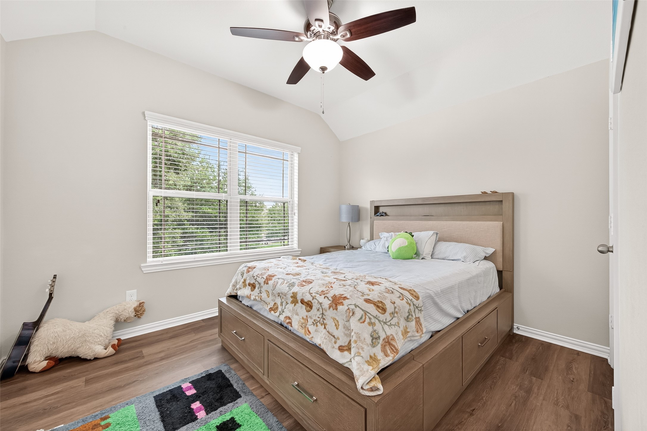 8 Landscape Court Conroe, TX 77301 - Photo 35 of 43 a bedroom with a bed and window