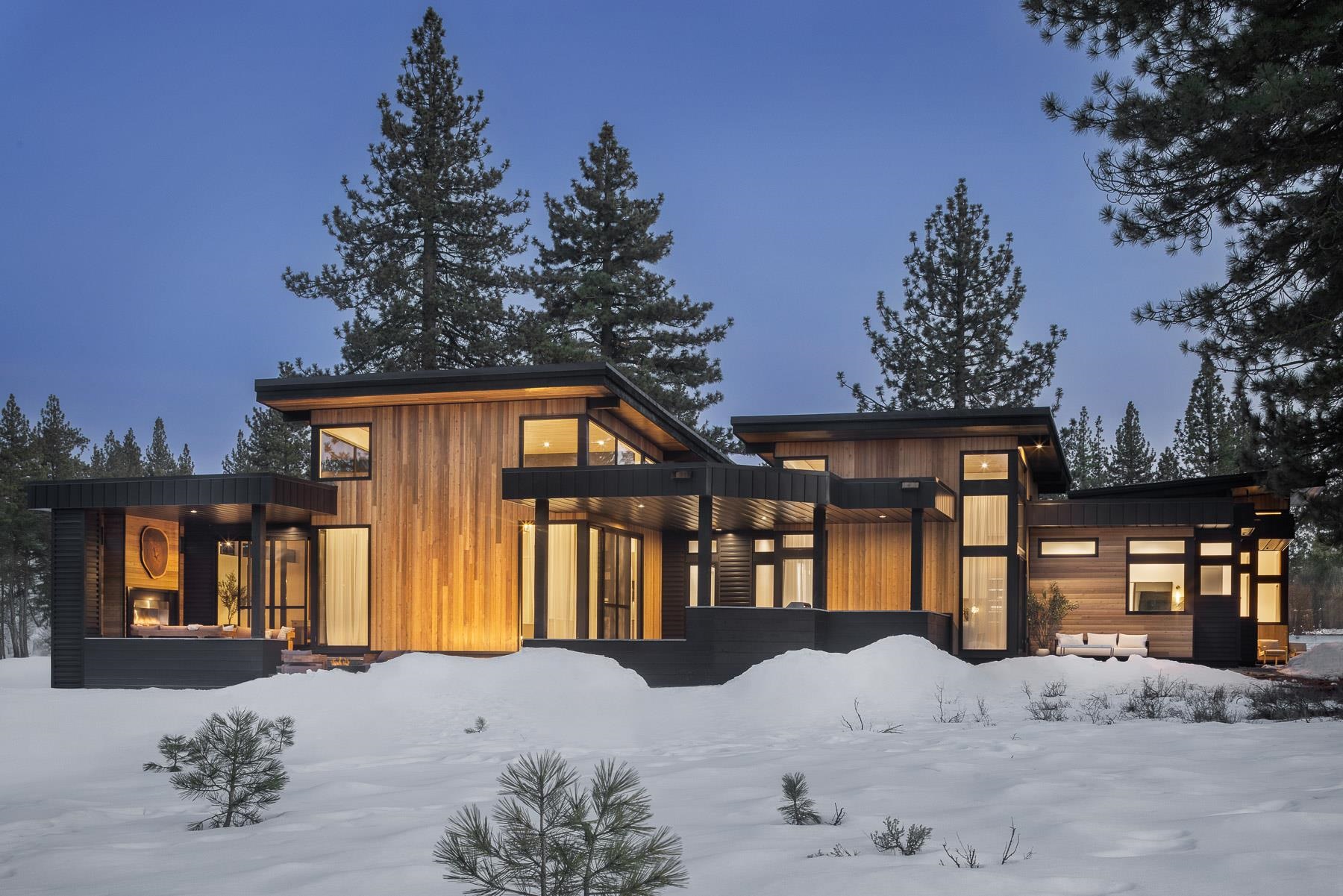 11633 Henness Road Truckee, CA 96161 - Photo 24 of 26 a front view of a house with a yard covered in snow