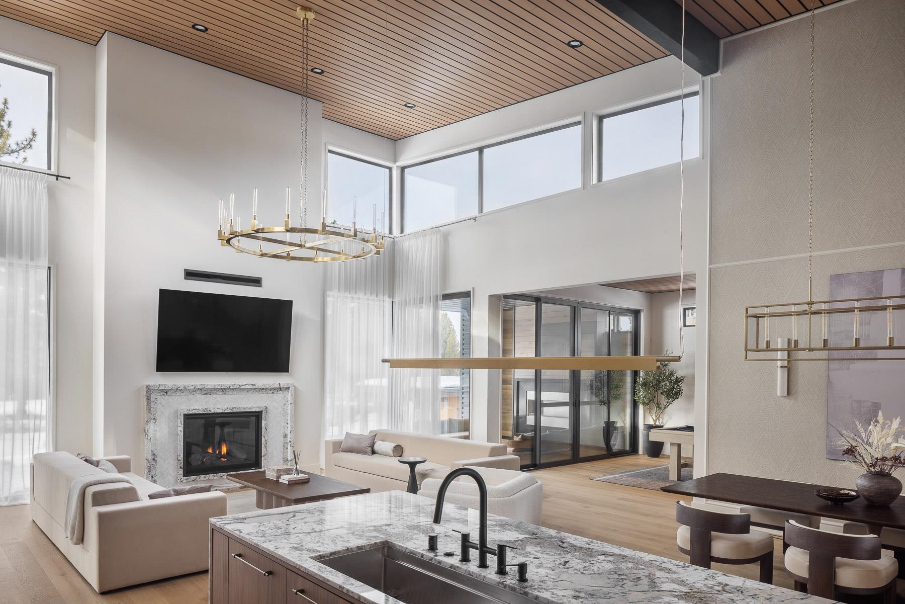 11633 Henness Road Truckee, CA 96161 - Photo 5 of 26 a living room with furniture a fireplace and a flat screen tv