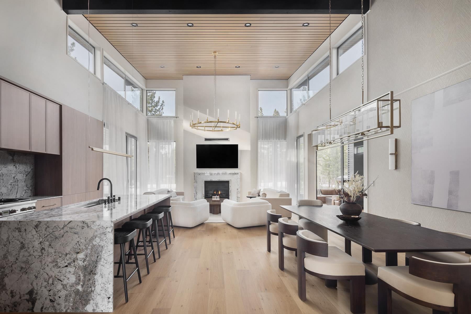 11633 Henness Road Truckee, CA 96161 - Photo 6 of 26 a living room with furniture kitchen view and a large window