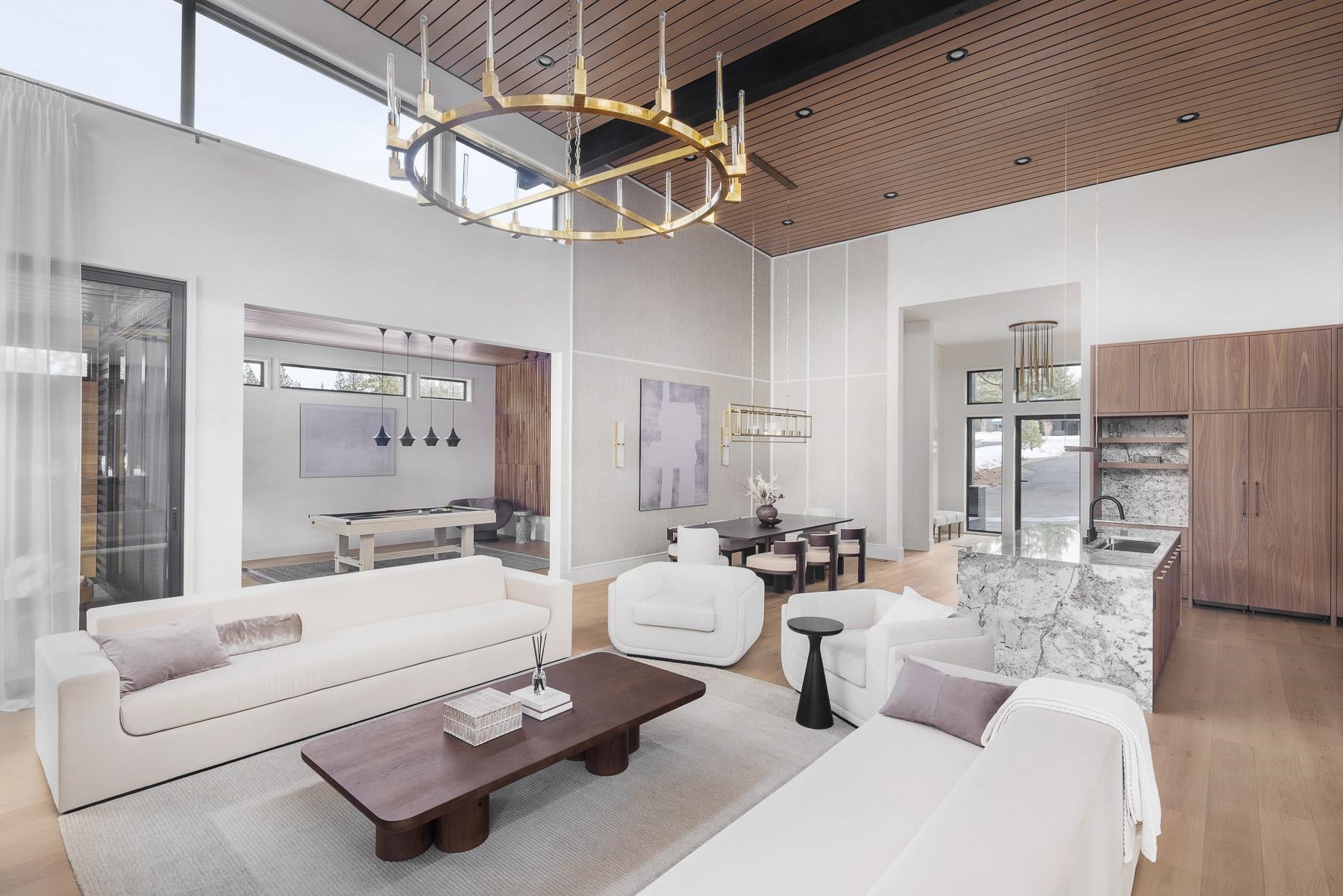 11633 Henness Road Truckee, CA 96161 - Photo 8 of 26 a living room with furniture and a chandelier