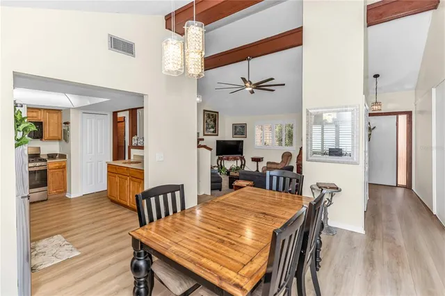 a view of a dining room with furniture and wooden floor